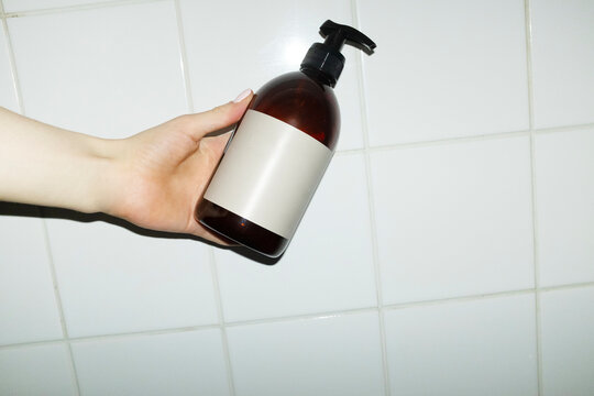 Minimal simple soap bottle with empty mockup label for text or design