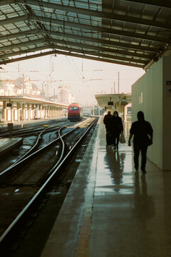 Silhouettes on Train Platform