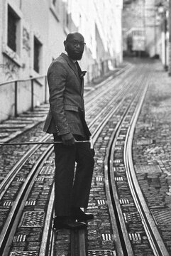 Suited Man on Funicular Tracks