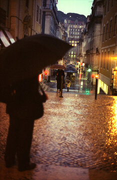 Umbrellas on Rainy Lisbon Street