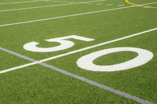 50 yard line on artificial turf football field
