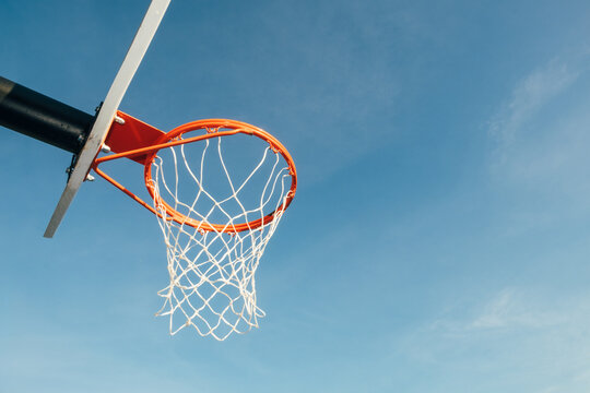 Basketball hoop with blue sky copyspace