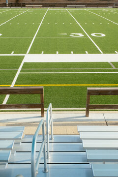 Empty football field viewed from bleachers