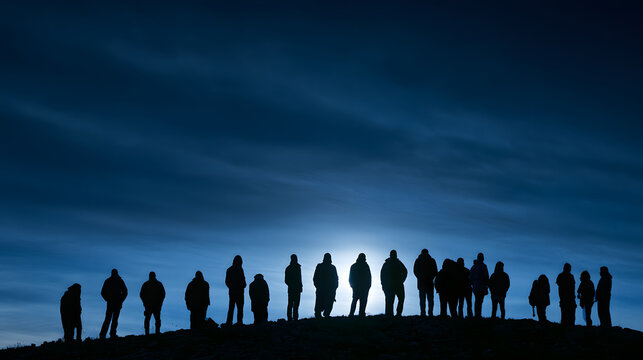 Silhouettes of diverse individuals against a moody twilight backdrop, highlighting a sense of unity and contemplation.
