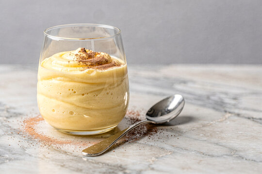 Creamy Zabaglione Dessert Dusted with Cocoa in Glass