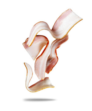 Sliced ​​bacon rashers in the air close-up on a white background