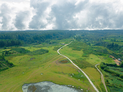 Aerial drone view of greenery grassland in Salaon Dolok, Samosir Island, Indonesia