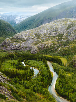 Norway nature aerial view - forest and river meanders through the mountain valley in Rago, beautiful travel destination epic moody landscape summer season in Scandinavia