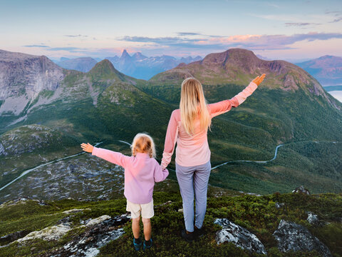 Mother and daughter travel in Norway family vacations outdoor parent and child hiking together, mom and kid enjoying Stetind mountain view healthy lifestyle tour explore Efjord