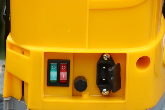 View of battery powered agriculture spray machine with on off switch and charging pins. Automatic agriculture tool for pest control