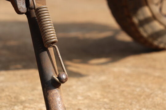 Side stand from an old motorbike with view of its spring