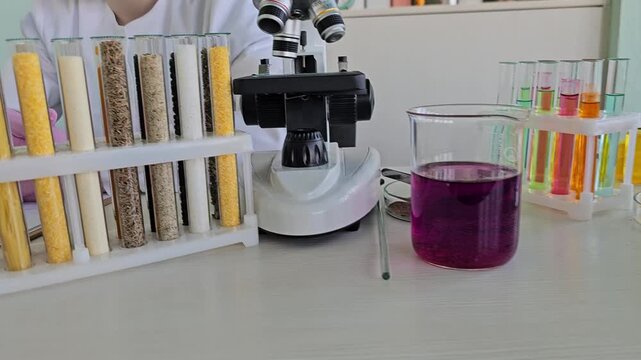 Science experiment with test tubes and microscope in laboratory setting