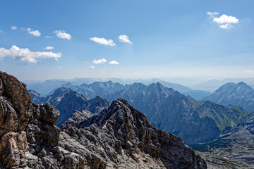 Obraz premium Layered Alpine mountain ranges seen from the summit of Zugspitze