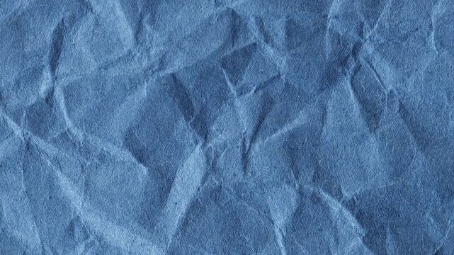 crumpled blue paper texture background animation, for creative projects, video overlays and bold artistic backgrounds. Abstract textured backdrop for creative projects.
