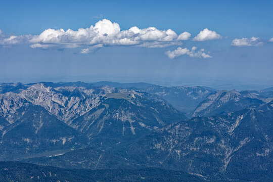 Layered Alpine Mountain Ranges and Paraglider Viewed from Zugspitze Summit
