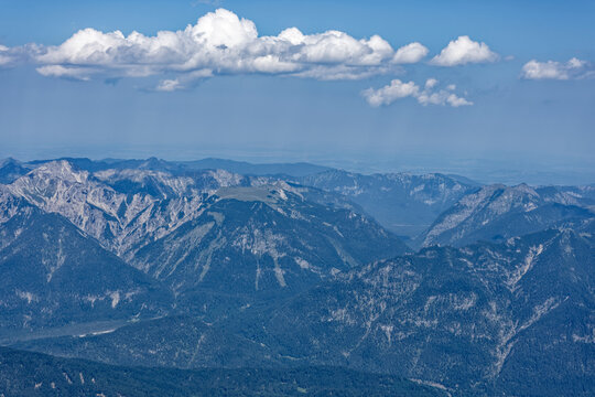 Layered Alpine Mountain Ranges and Paraglider Viewed from Zugspitze Summit