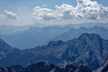 Fototapeta premium Layered Alpine mountain ranges seen from the summit of Zugspitze