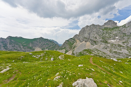 Durmitor National Park mountain landscape with rocky green hills and clouds