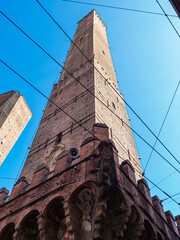 Medieval Asinelli Tower Framed by Modern Overhead Wires in Bologna, Italy © Piotr