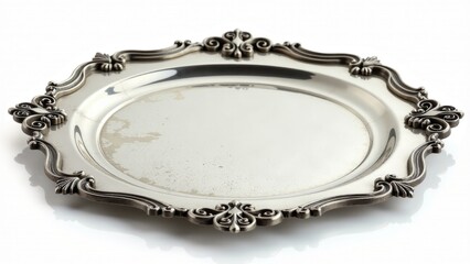 Naklejka premium A silver plate on a clean white surface, ideal for food presentation or as a decorative element