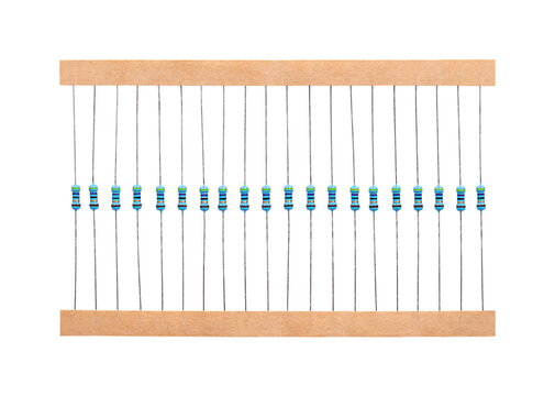 Metal film resistors on tape. 20 axial-leaded resistors, through-hole electronic components with wire leads extending straight out from both ends of the cylindrical body. Isolated, from above. Photo