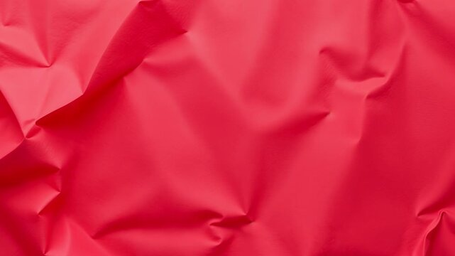 crumpled red paper texture background animation, for creative projects, video overlays and bold artistic backgrounds. Abstract textured backdrop for creative projects.