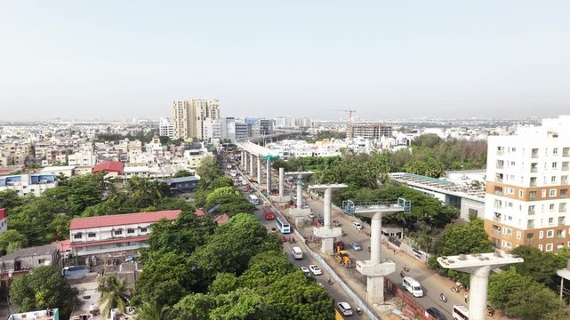 Metro rail construction piers rising through a residential city district - August, 2026, Chennai, India