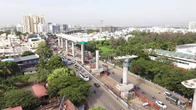Metro rail construction along a busy road in the growing city - August, 2026, Chennai, India