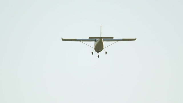Small single engine propeller airplane landing