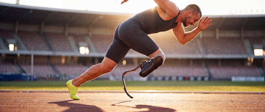 Amputee runner sprinting on running track with carbon blade prosthesis in dynamic motion under warm golden sunlight, showcasing determination for sports and fitness campaigns