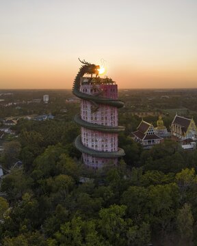 Aerial view, sun in the mouth of a dragon, Wat Samphan dragon temple, Bangkok, Thailand