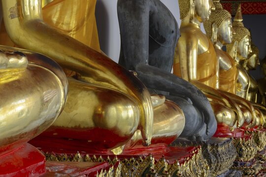 Gold-plated Buddha statues (Bhumispara-mudra: Gautama Buddha at the moment of enlightenment), Wat Pho, Bangkok, Thailand
