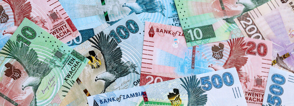 Zambian kwacha money banknotes pile on table. Zambia bills of ZMW currency close up
