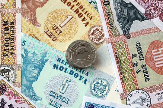 Moldovan leu money bills and coins in pile. Big amount of Moldova MDL currency cash close up