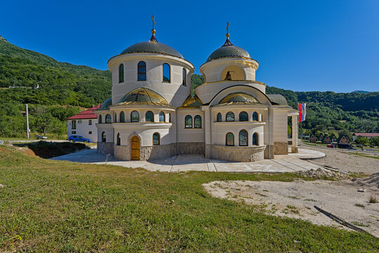 Orthodox church in Montenegro with mountain landscape and blue sky background