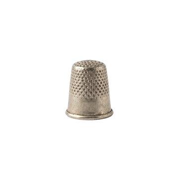 Vintage silver metal thimble featuring textured dimples designed for protection during intricate needlework craft projects against a clean white surface