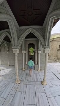 Woman Running Through Columns of Rabati Castle, Georgia, Slow Motion