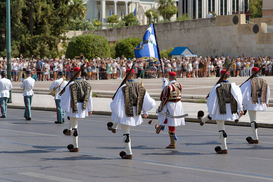 Rear view of the Evzones marching during the Changing of the Guard ceremony outside the Hellenic Parliament.
