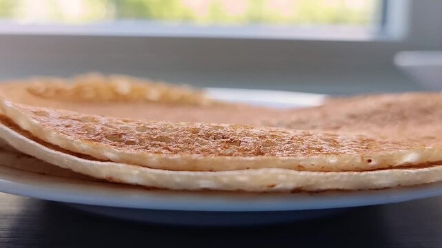 Close-up of large pancakes. Hot steam