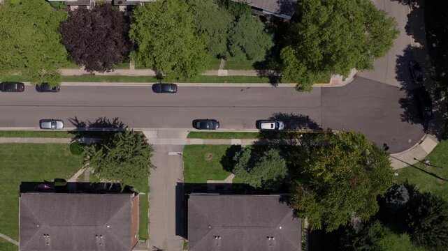 Medium income and middle class Midwestern American homes, houses, rental property residences, and townhouse duplexes in average older neighborhood outside Columbus, OH in Ohio suburb from drone aerial