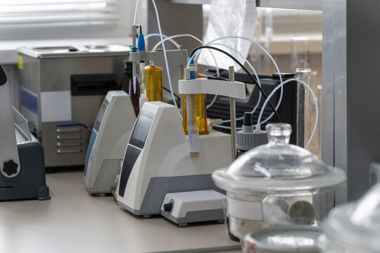 Automated titration equipment with amber reagent bottles, tubing and glassware
