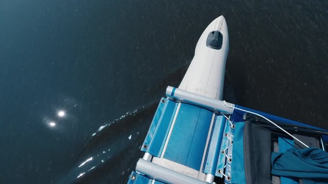 Detail of the inflatable boat moving on the lake