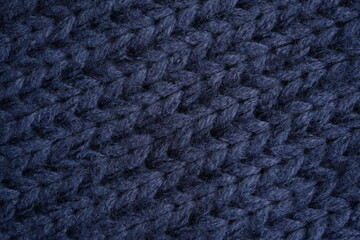 Blue acrylic knitted fabric texture background dark blue chunky knitted fabric with thick yarn and...