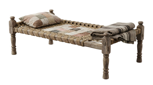 Vintage wooden charpai bed with woven jute rope, traditional Indian daybed with patchwork pillow and wool blanket, rustic handmade furniture isolated on White Background