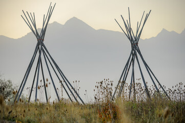 Bare Teepee Pole Frames in Misty Mountain Meadow, Glacier National Park, Montana © davidmarx
