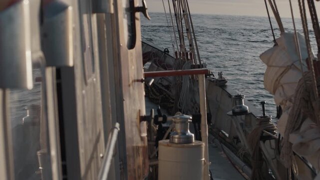 Expeditional sailing vessel moves in the open ocean