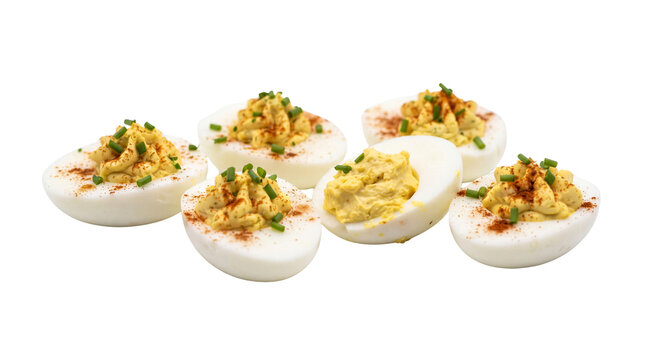 Classic deviled eggs with paprika and chives, traditional stuffed egg appetizer on white background, gourmet party snacks