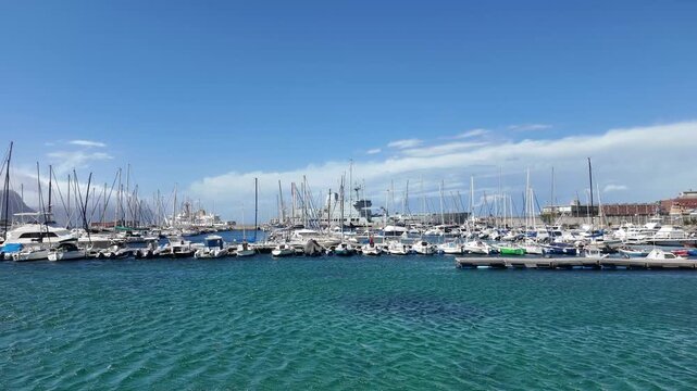 Simon's Town Western Cape South Africa. 18.02.2026. Video.  A bustling marina in Simon's Town, filled with sailboats and yachts, with calm, turquoise waters reflecting the bright daylight