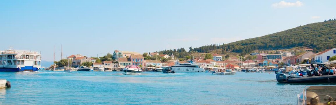 Cinematic View of Fiskardo Harbor in Kefalonia, Greece
