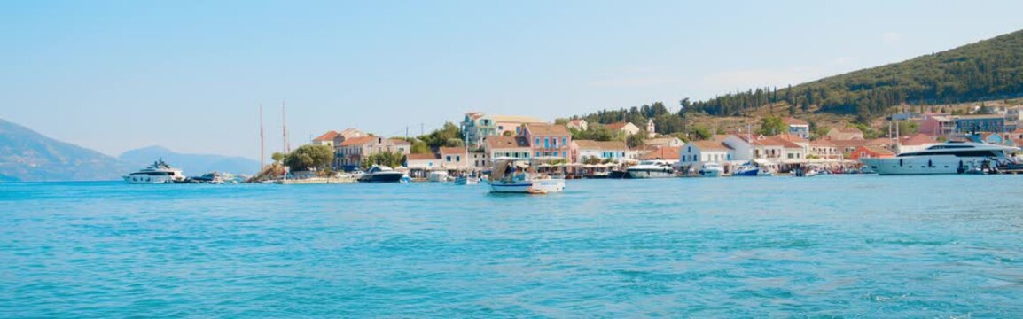 Cinematic View of Fiskardo Harbor in Kefalonia, Greece
